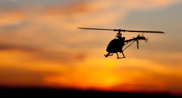 A naplemente helikopter Stock Fotó