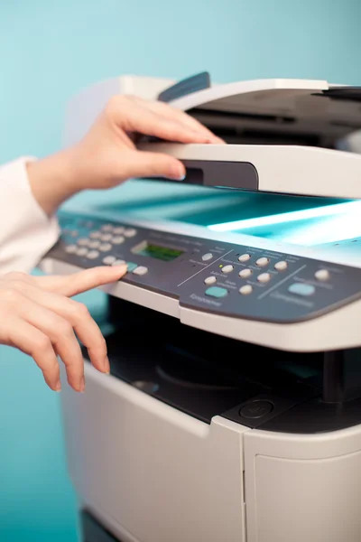 Woman's hand with copier — Stock Photo, Image