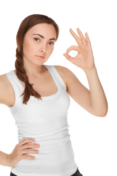 Beautiful woman in white vest giving okay sign isolated — Stock Photo, Image