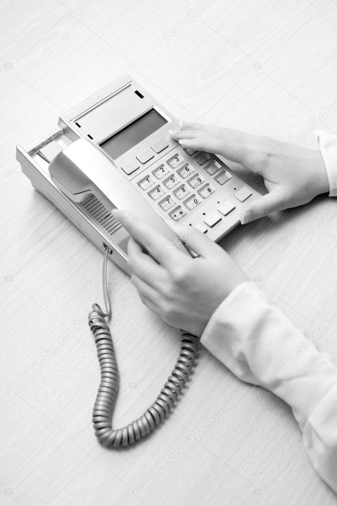 Woman's hands with telephone