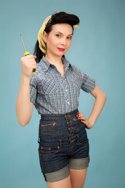 Picture of beautiful pin up woman with tool — Stock Photo, Image