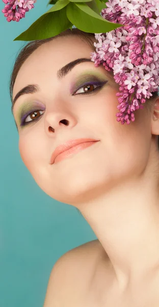 Portrait of beautiful woman with makeup and branch of lilac — Stock Photo, Image