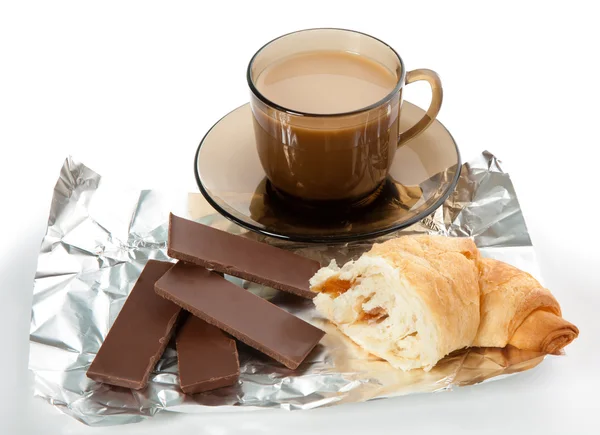 A cup of coffee, cornetto and a four pieces of chocolate — Stock Photo, Image