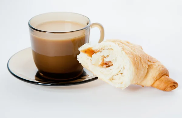 A cup of coffee and a cornetto — Stock Photo, Image