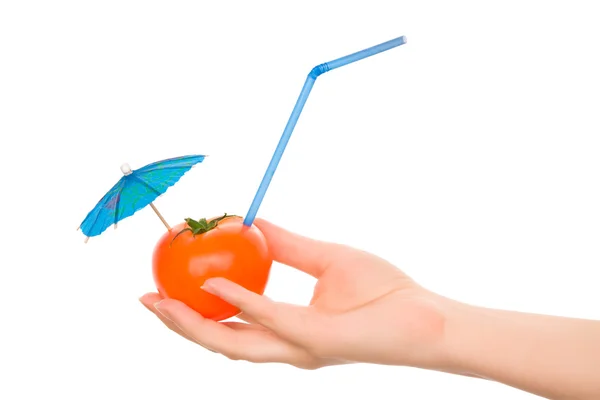 Tomato with straw and cocktail umbrella — Stock Photo, Image