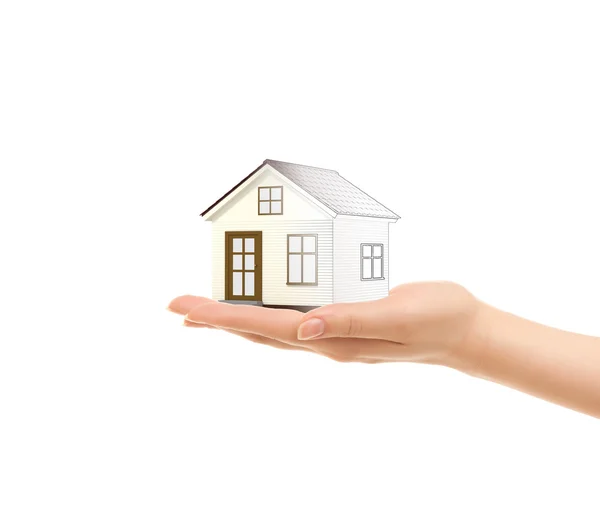 Picture of woman's hands holding a house — Stock Photo, Image