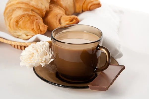 A cup of coffee, chocolate and cornettos — Stock Photo, Image