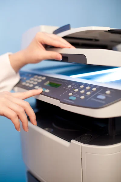 Woman's hand with copier — Stock Photo, Image