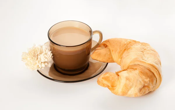 A cup of coffee and a cornetto — Stock Photo, Image