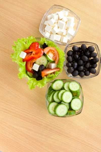Picture of plates with vegetables and greek salad — Stock Photo, Image