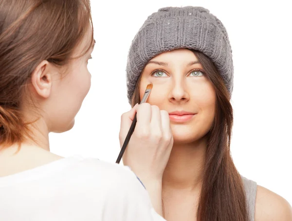 Make-up artist applying makeup onto performer's face — Stock Photo, Image