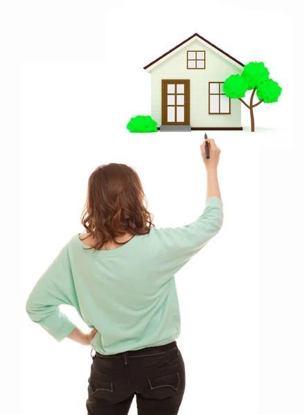 Woman with marker drawing house — Stock Photo, Image