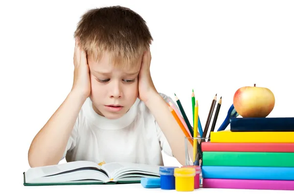 Sad schoolboy doing is homework — Stock Photo, Image