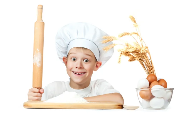 Little scullion is kneading dough — Stock Photo, Image