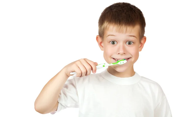 Cheerful boy is brushing his teeth isolated — Stock Photo, Image