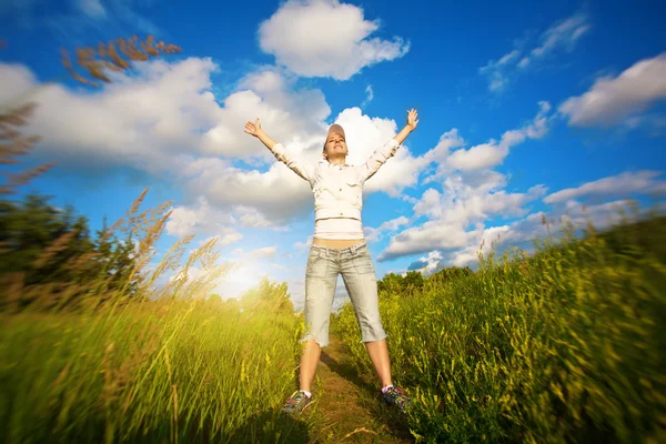 Happy girl over the blue sky — Stock Photo, Image