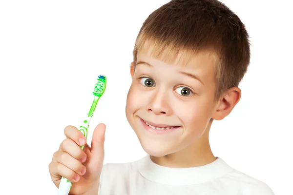 Chłopiec jest szczotkowanie zębów. na białym tle — Zdjęcie stockowe