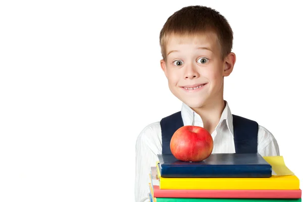 Cute student is holding books and apple. isolated — Stock Photo, Image