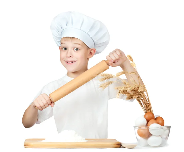 Cute scullion is kneading dough — Stock Photo, Image