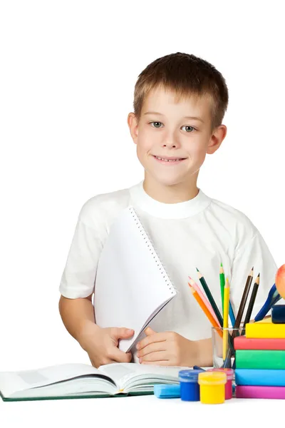 Netter Schuljunge mit Büchern und Bleistiften — Stockfoto