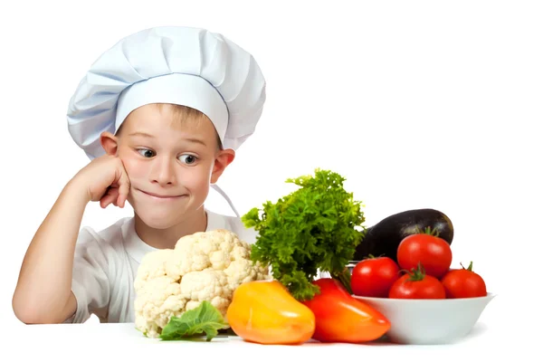 Cute scullion with raw vegetables — Stock Photo, Image