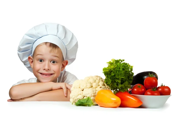 Cute scullion with raw vegetables — Stock Photo, Image