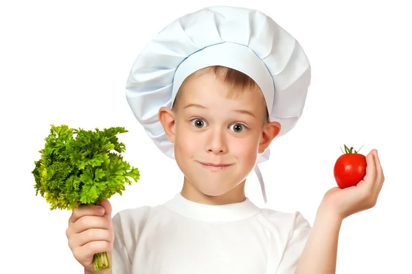 Bonito menino Chef está sorrindo. Produtos hortícolas em bruto — Fotografia de Stock