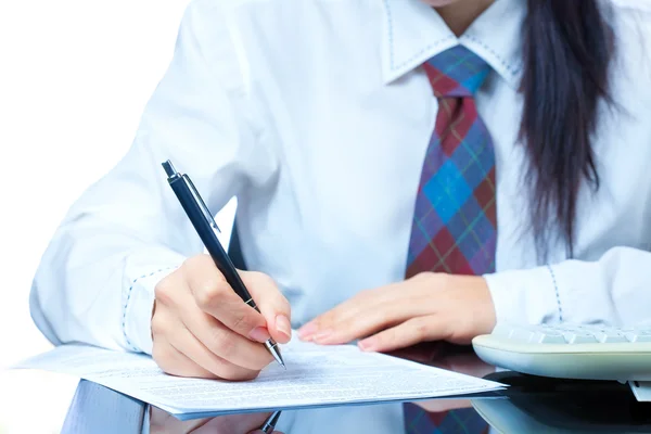 Girl at work in the office. sign documents — Stock Photo, Image