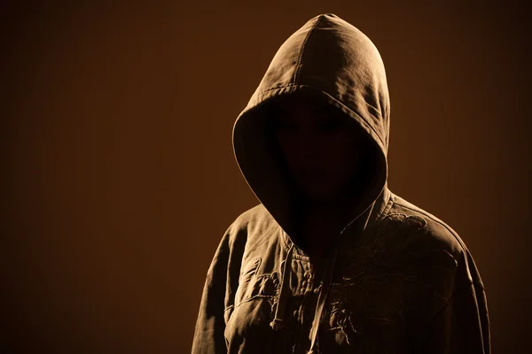 Scary woman with hood in darkness — Stock Photo, Image