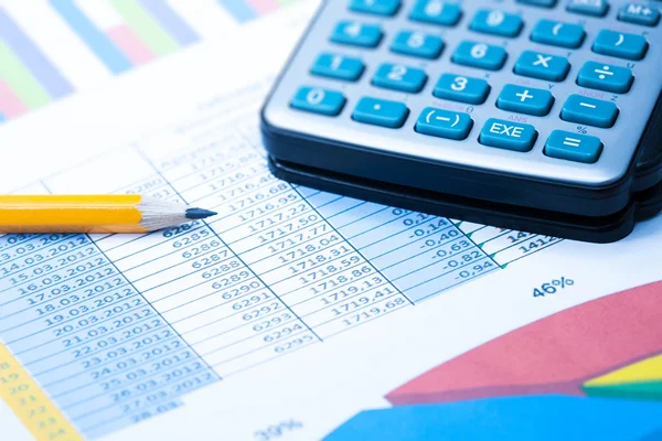 Finance Statistical graphs and calculator — Stock Photo, Image