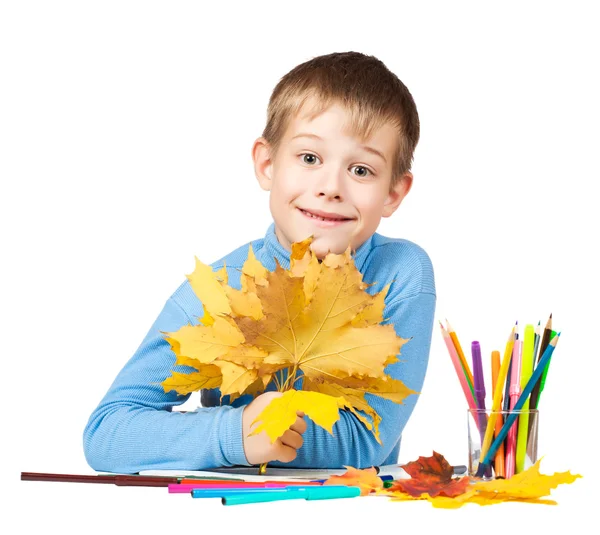 Funny schoolboy is drawing with pencils — Stock Photo, Image