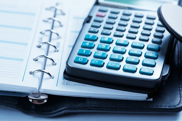 Calculator and notebook — Stock Photo, Image