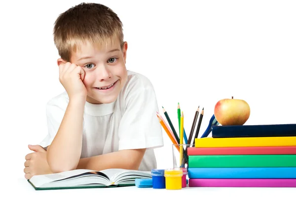 Trevlig unge med böcker och pennor — Stockfoto