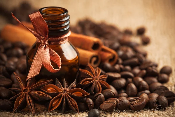 Bottle coffee aroma oil with aromatic coffee beans — Stock Photo, Image