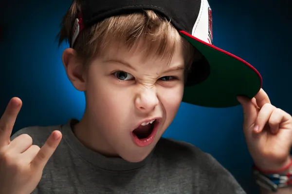 Angry boy rapper is posing a face — Stock Photo, Image