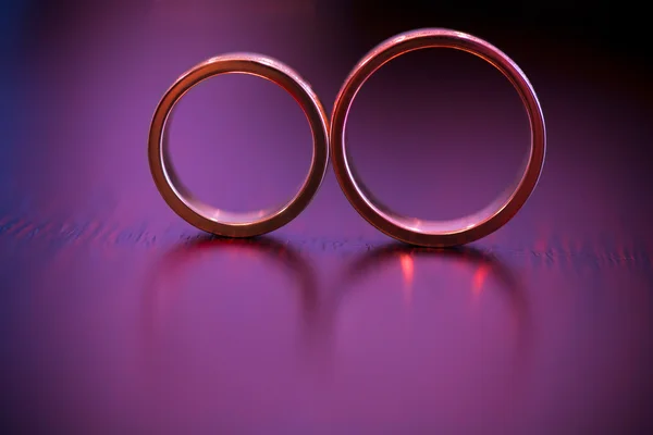 Beautiful golden rings on the table — Stock Photo, Image