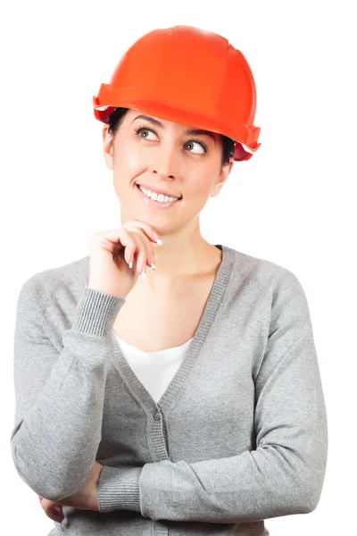 Giovane donna con cappello duro arancione su bianco — Foto Stock