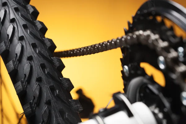 Part of the mountain bike, front sprocket and tire — Stock Photo, Image