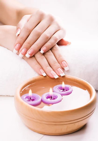 French manicure with aromatic candles and towel. Spa — Stock Photo, Image