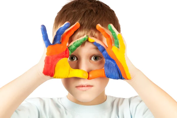 Niño agradable con la mano teñida de color — Foto de Stock