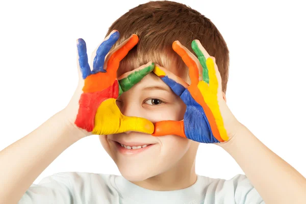 Niño feliz con la mano manchada de color — Foto de Stock