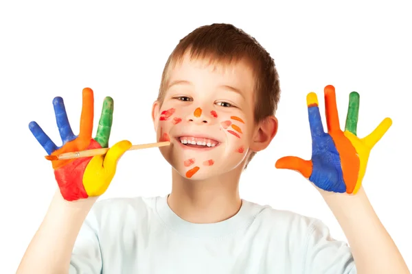 Sorrindo menino feliz com a mão colorida manchada — Fotografia de Stock