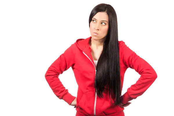 Angry young woman standing against white — Stock Photo, Image