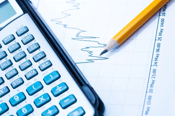 Finance Statistical graphs and calculator — Stock Photo, Image