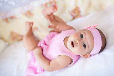Cute baby girl in a pink dress Stock Photo titov 29173379