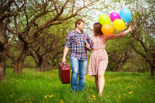 Happy loving couple on a spring meadow — Stock Photo, Image