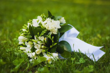 White wedding flowers on the green grass clipart