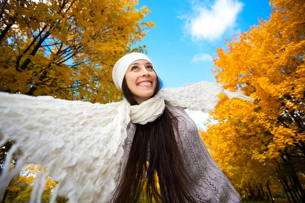 Happy woman on a autumn sky background — Stock Photo, Image