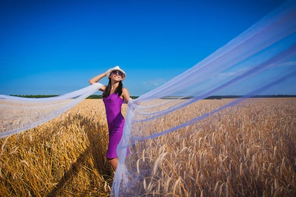 Girl with veil on the yellow field — Stock Photo, Image