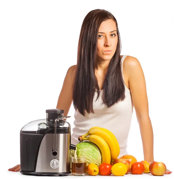 Happy woman is pressing the juice from the fruit — Stock Photo, Image